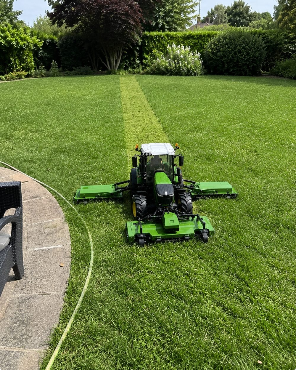 GrassWorks GX-64 mower features and build details, showing the deck, wheels and folding frame